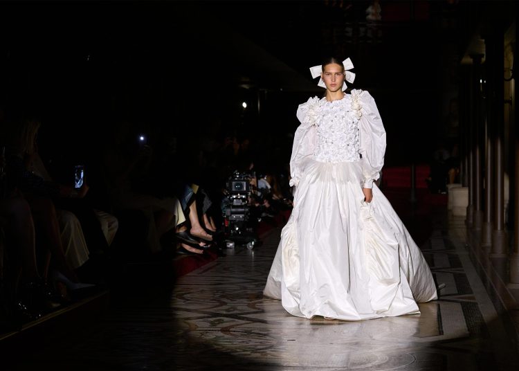 Chanel presents haute couture apparel at the Opera theater in Paris.